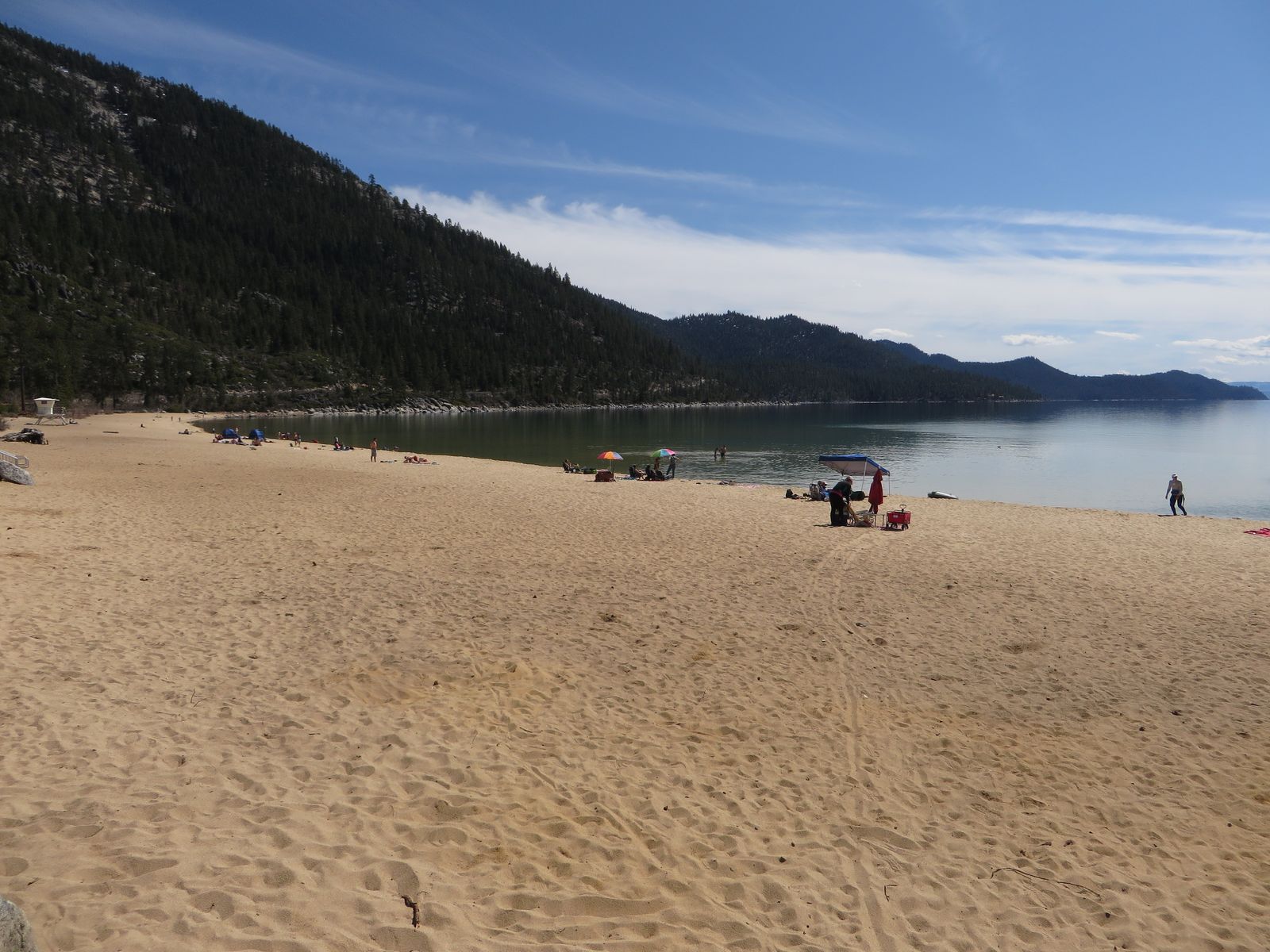 Sand Harbor's beach below the forested east shore of Lake Tahoe
