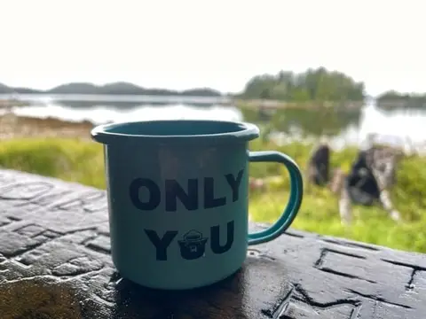 Mug sitting on the ledge of Goddard Hot Springs bath house, Sitka, AK. USDA Forest Service photo by Meghan Chamberlain