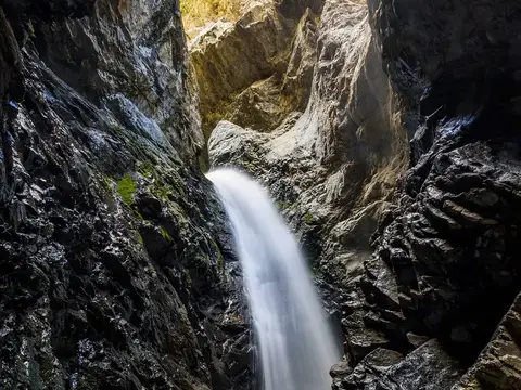 Zapata Falls in its narrow rock crevasse